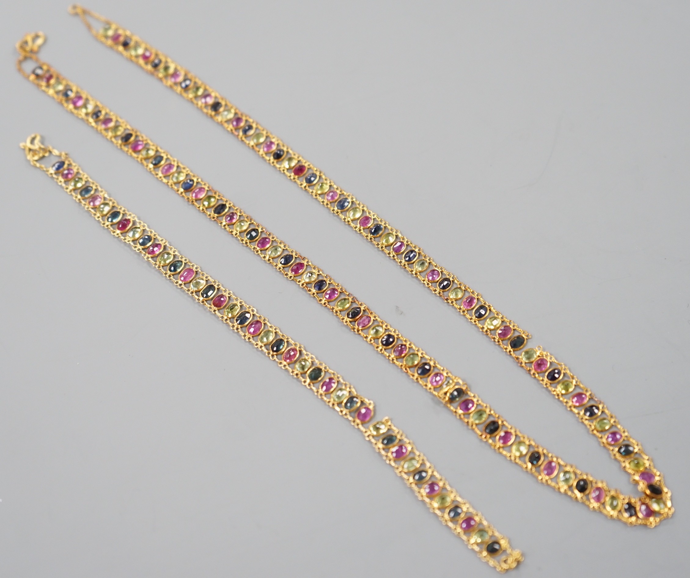 A continental yellow metal and multi gem necklace, 39cm and matching bracelet, 17cm, gross weight 12.1 grams. - two links a.f.